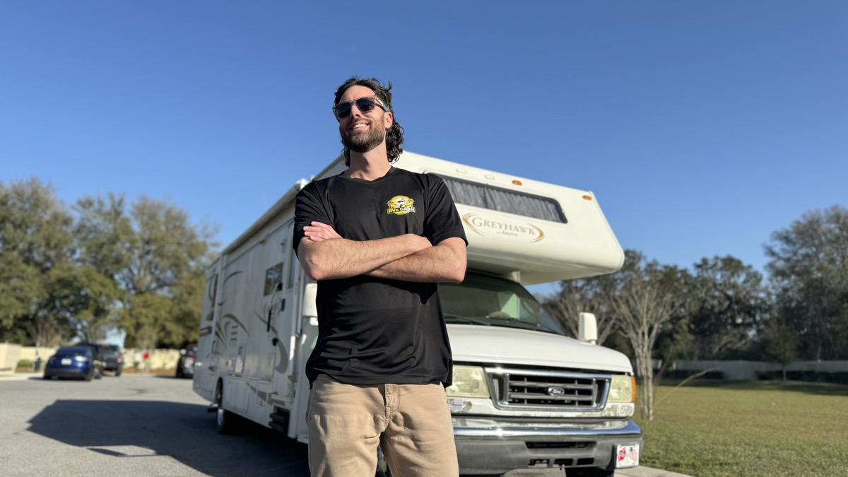 The buyer from We Buy RVs Cash standing in front of a Class C motorhome in Central Florida