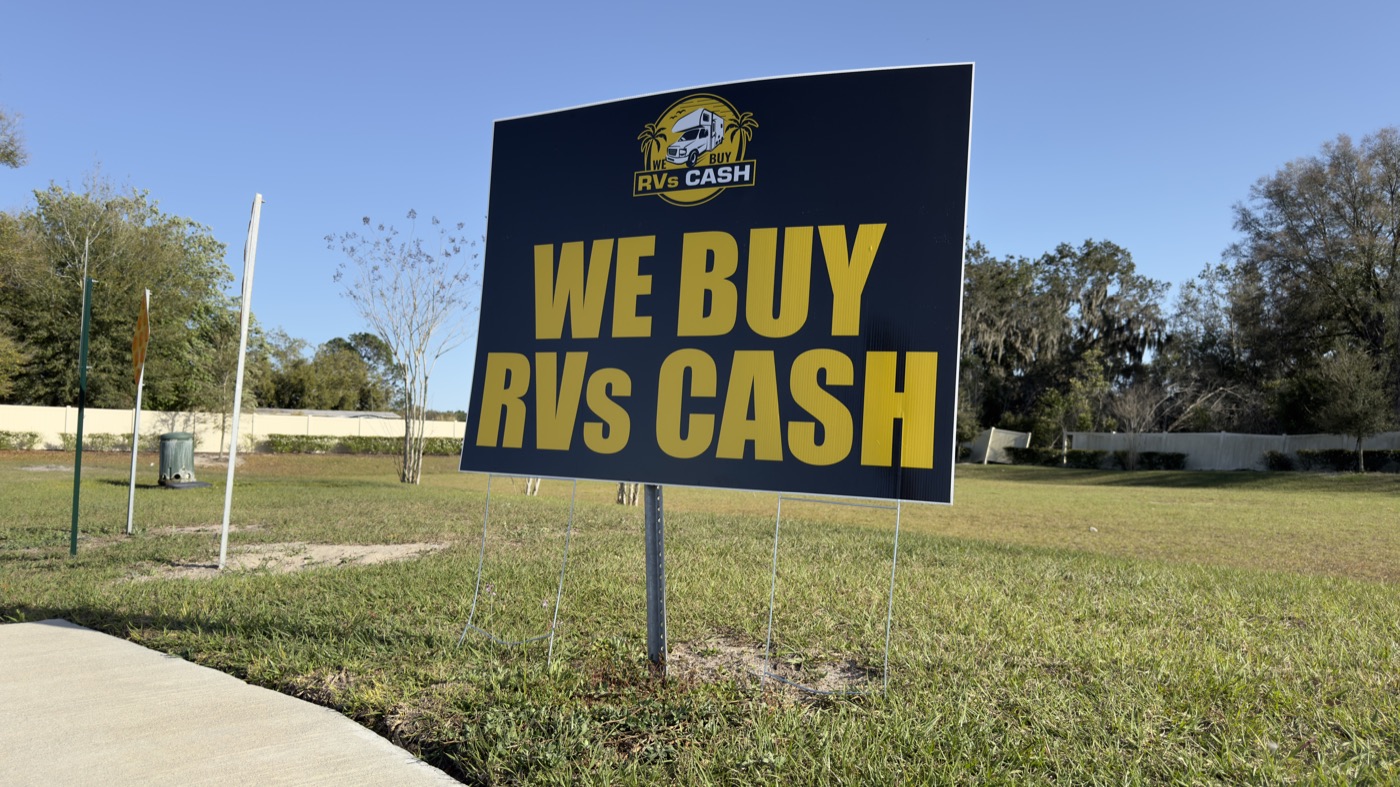 We Buy RVs Cash sign at the curb of a completed sale — serving Ocala
